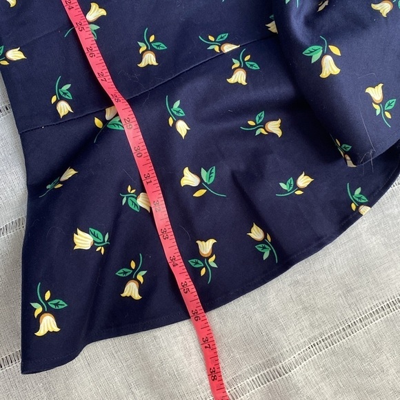 Draper James navy floral sleeveless dress with ruffled hem. - Picture 9 of 12